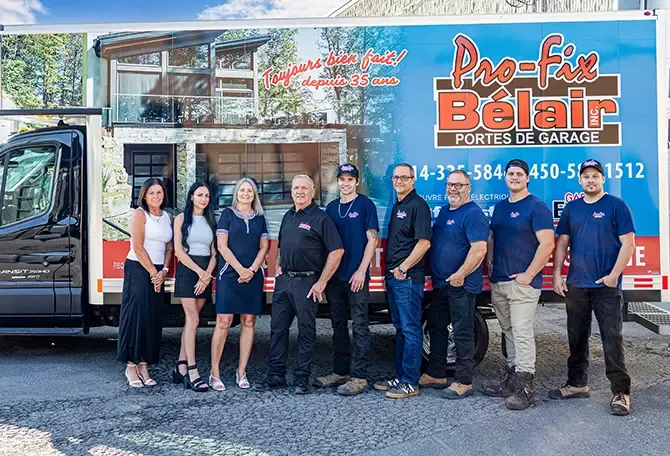 Work team in front of their service trucks.